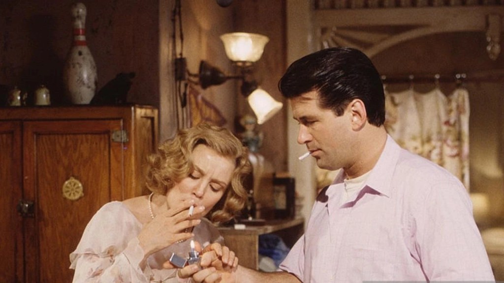 Stanley (Alec Baldwin) lighting Blanche's (Jessica Lange) cigarette. 