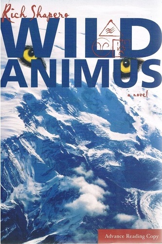 The book cover showing a snowy mountain from way up high, with animal eyes over it.