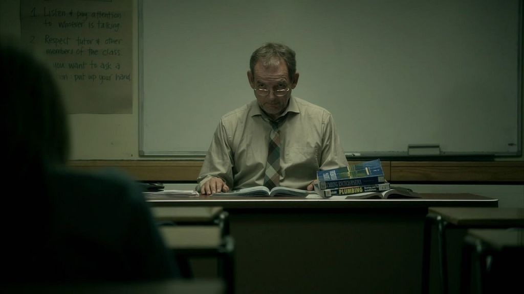 Robert Anderson (David Schofield) teaching class.