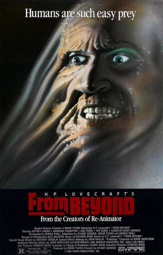 The movie poster showing a wildly smiling face that seems to be dissolving.