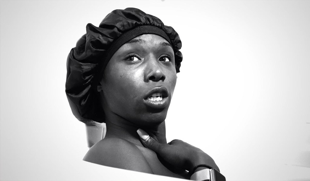 Daniella Carter sitting in a bathtub.