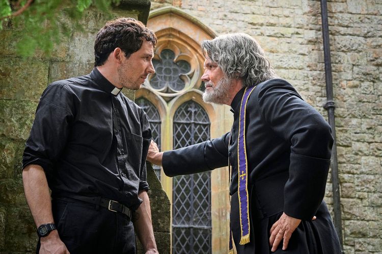Jud Duplenticy (Josh O'Connor) and Monsigneur Jefferson Wicks (Josh Brolin) facing each other outside of church.
