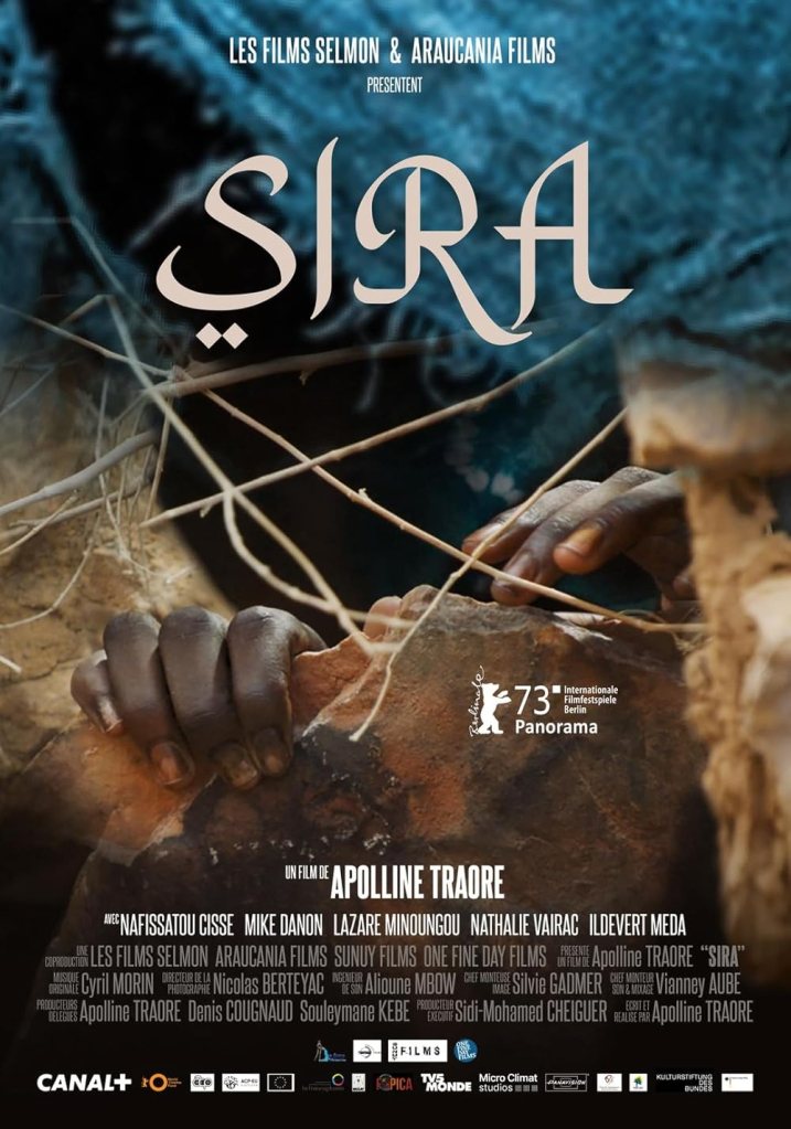 The movie poster showing a pair of hands reaching out of a cave. 