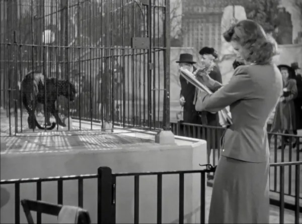 Irena (Simone Simon) drawing a panther at the zoo. 