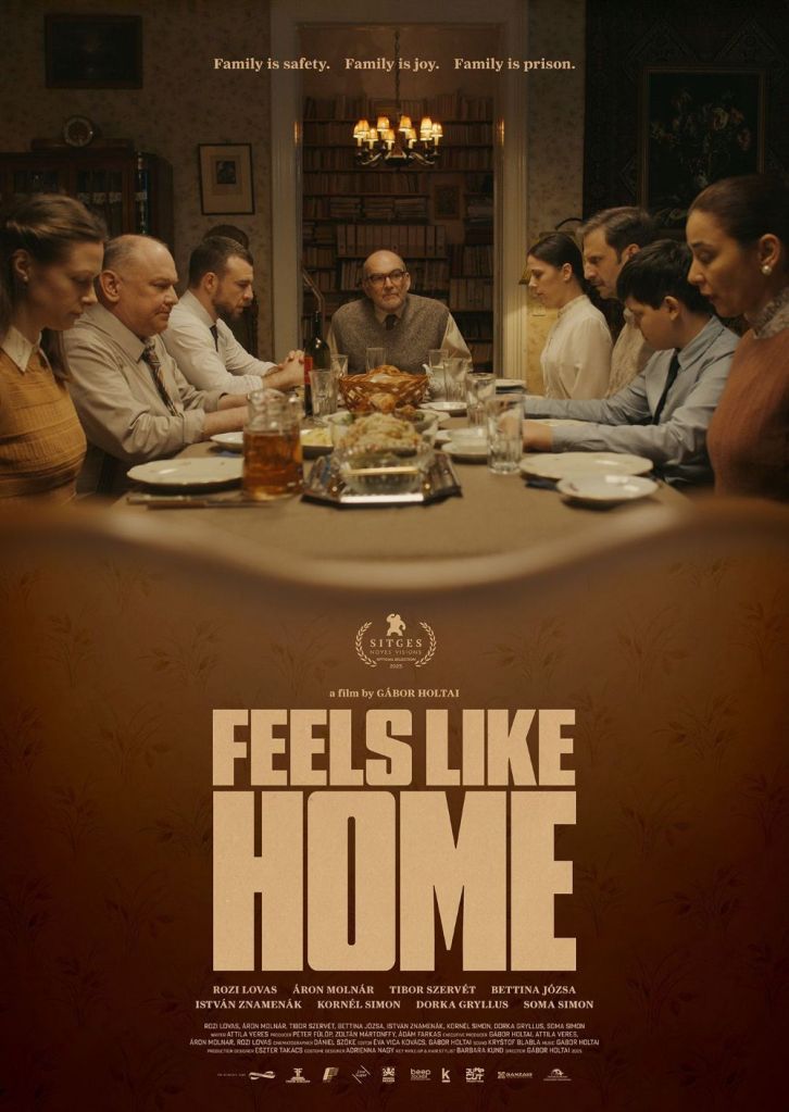 The movie poster showing the family seated around a table, the father at the head. Everybody is looking down and kind of tense.