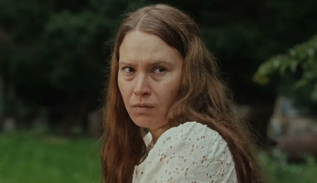 Saga (Seidi Haarla) looking back over her shoulder. She looks tired and somewhat pissed off. 