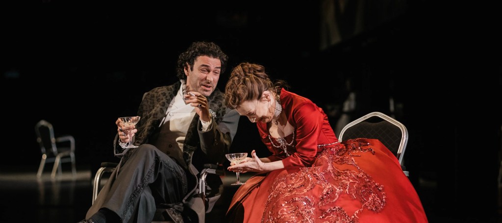 Valmont (Aidan Turner) and the Marquise de Merteuil (Lesley Manville) laughing together. 