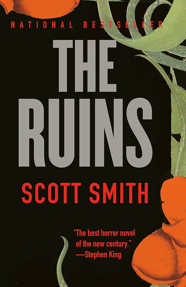 The mostly black book cover. It has some green tentacle-like leaves and red flowers at its edge where you open it.