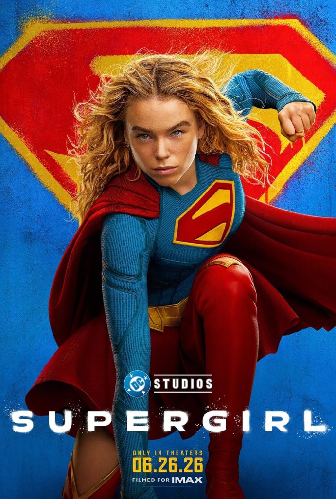 The movie poster showing Kara aka Supergirl (Milly Alcock) in a typical superhero pose with blowing hair and the Superman S behind her.