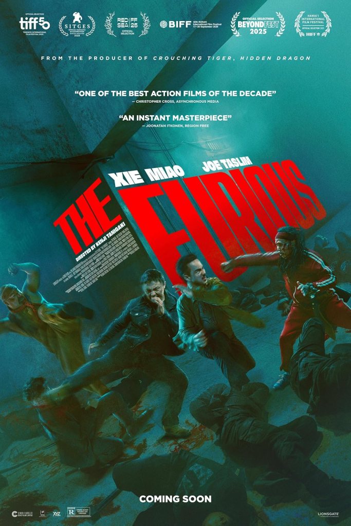 The film poster showing many black-clad people lying on the floor as if dead and two people attacking Dad (Xie Miao) and Navin (Joes Taslim) who are standing in the middle of the bodies.