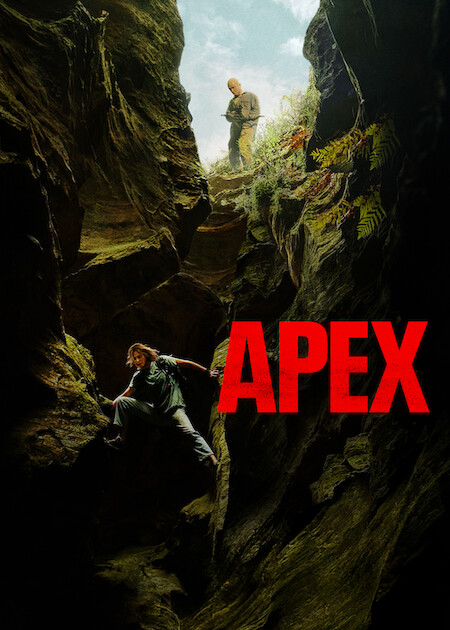 The movie poster showing Sasha (Charlize Theron) climbing down a rocky crack. Ben (Taron Egerton) stands above her, aiming a crossbow at her.